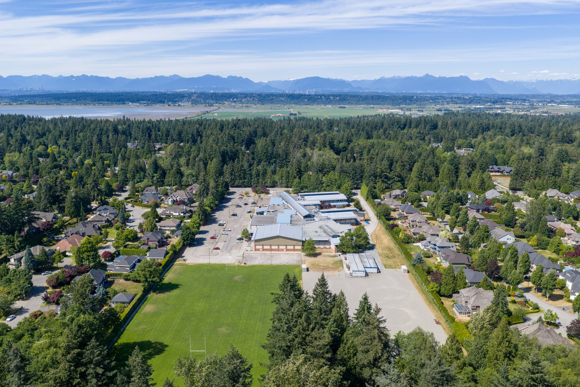 Drone view of the neighbourhood toward the mountains