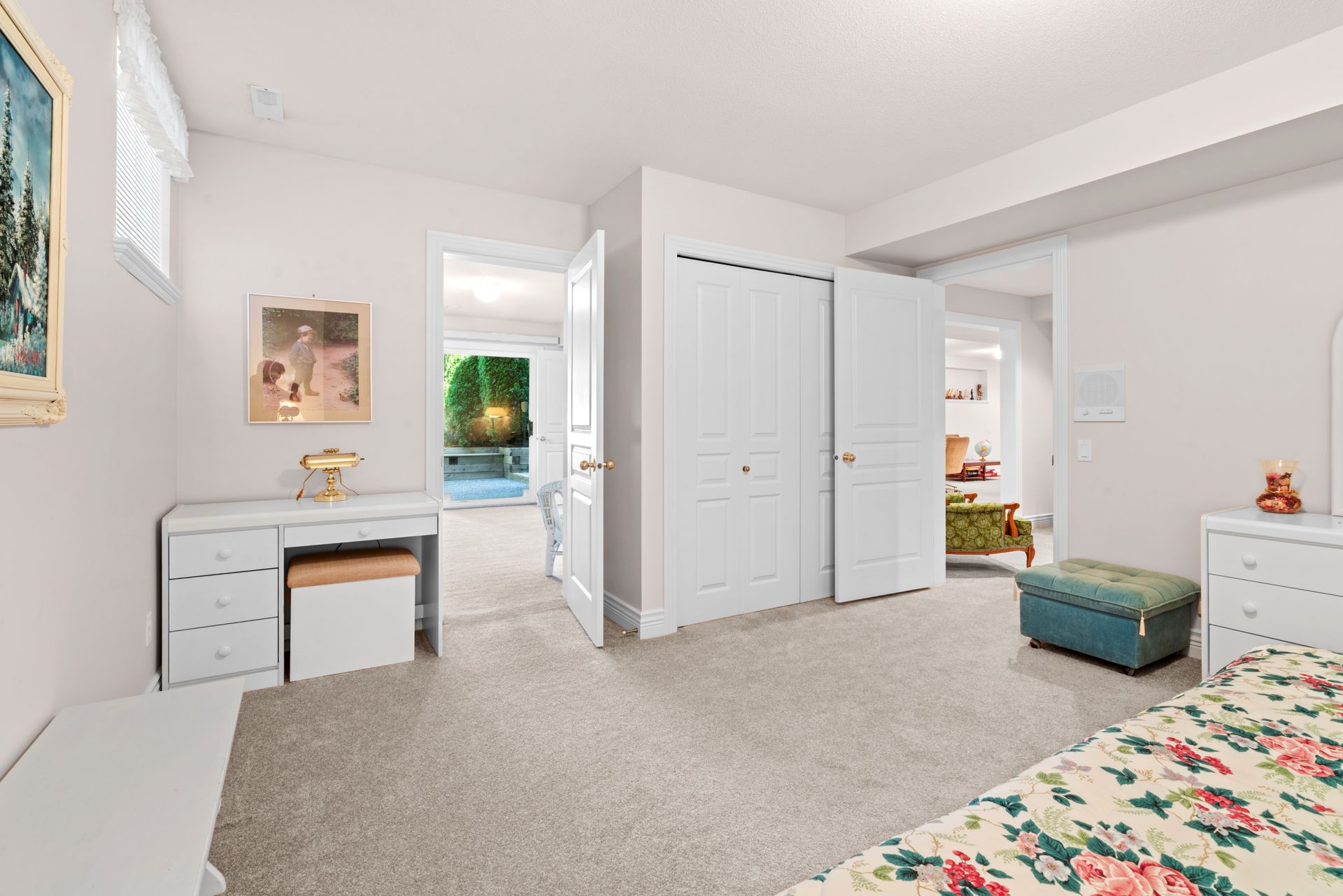 Lower level room with a desk and closets