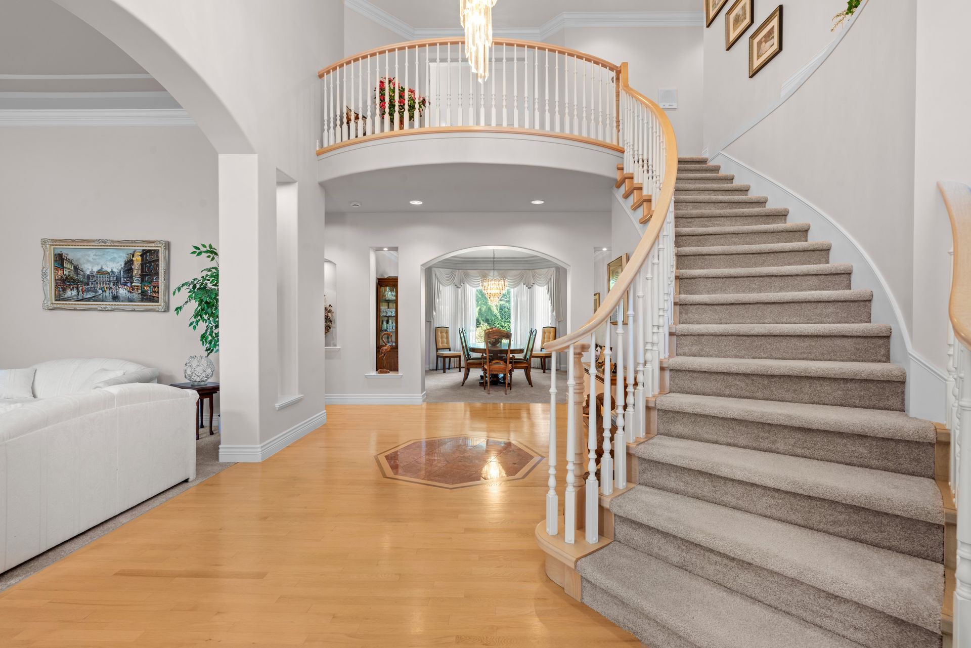 Curved staircase in the front entry