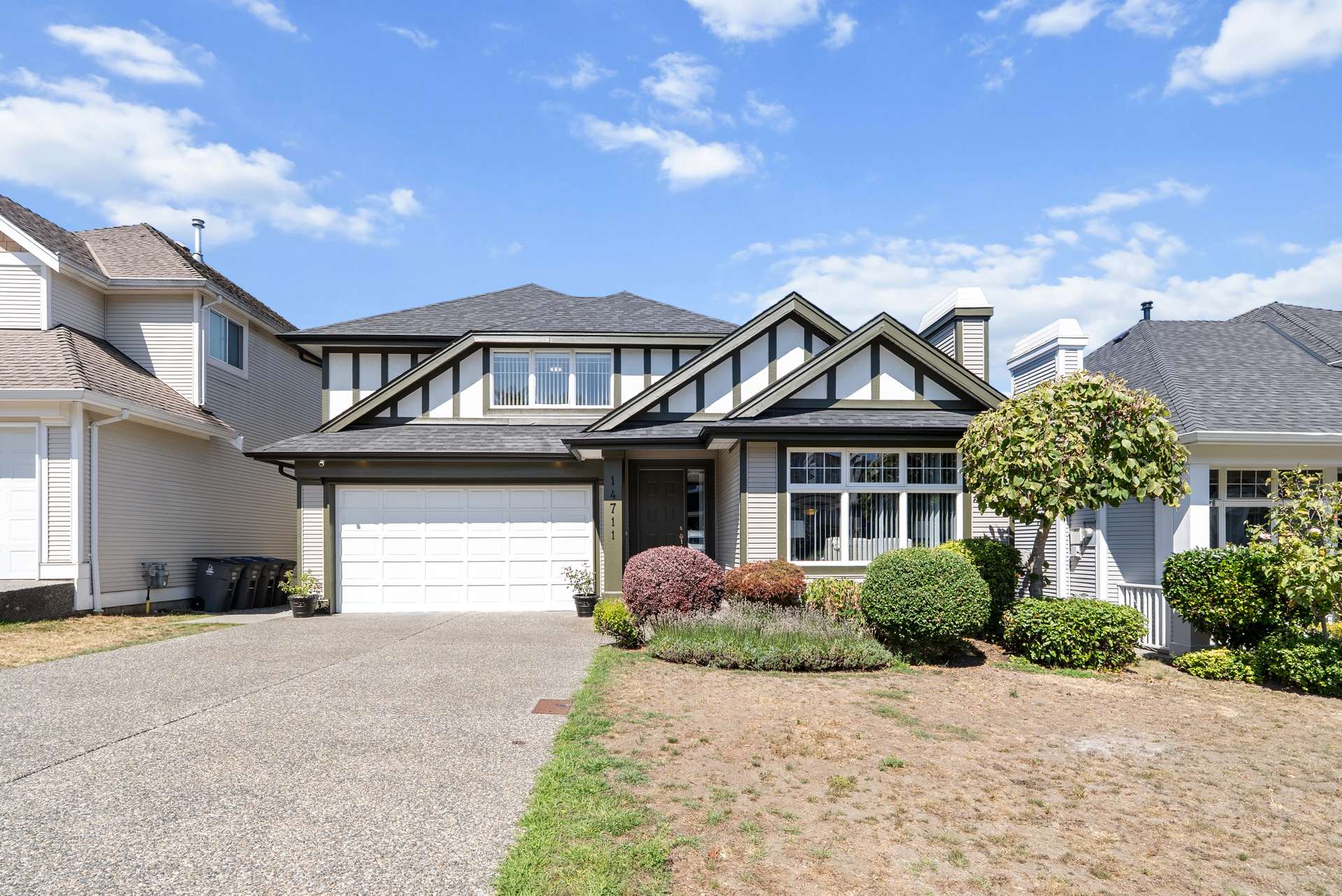 Front exterior of a family home on a sunny day