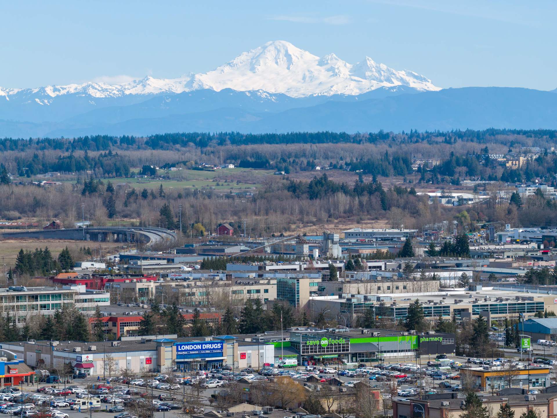 Mount Baker rising over Langley from the air