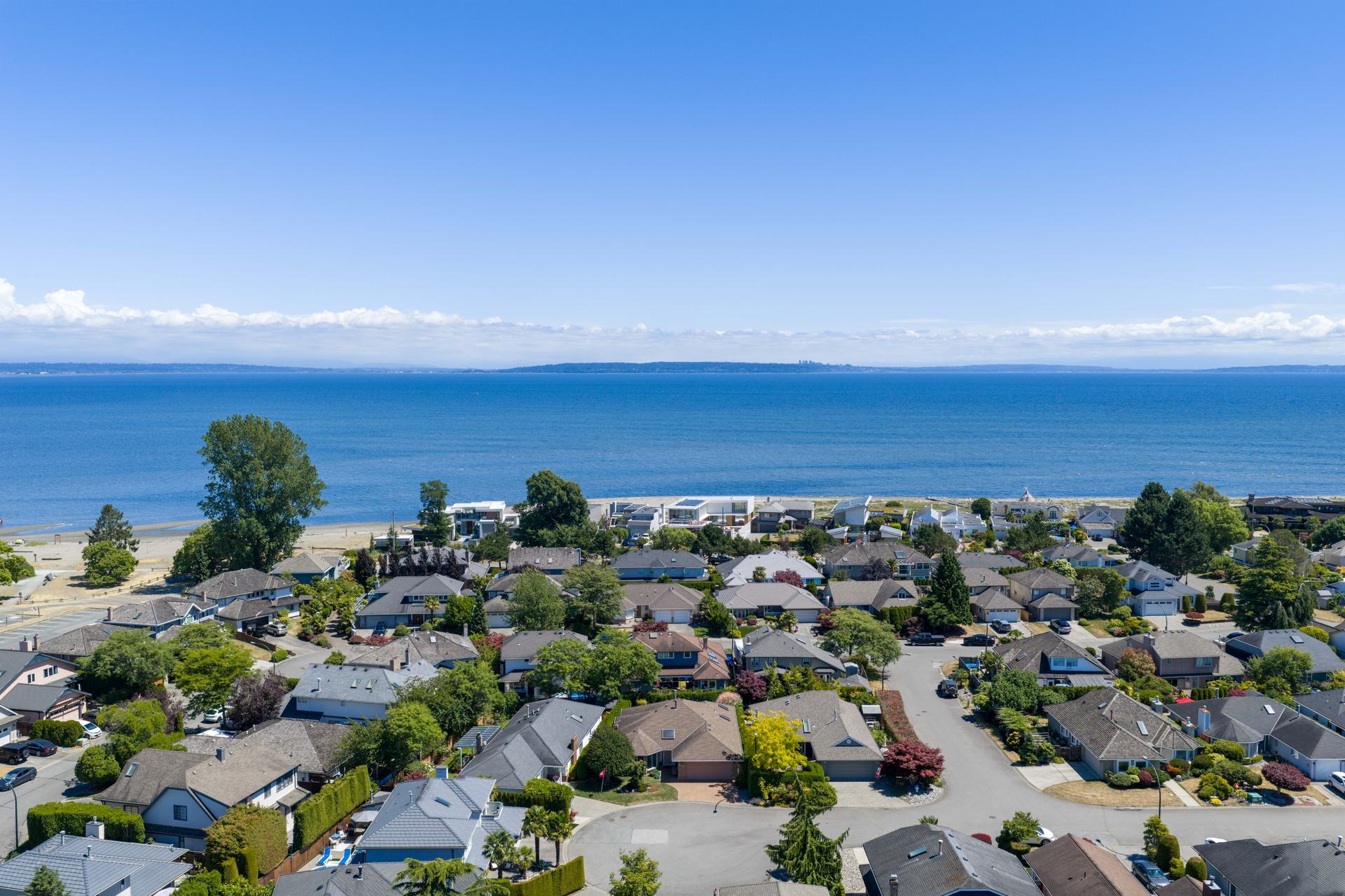 Waterfront homes and the ocean from a drone
