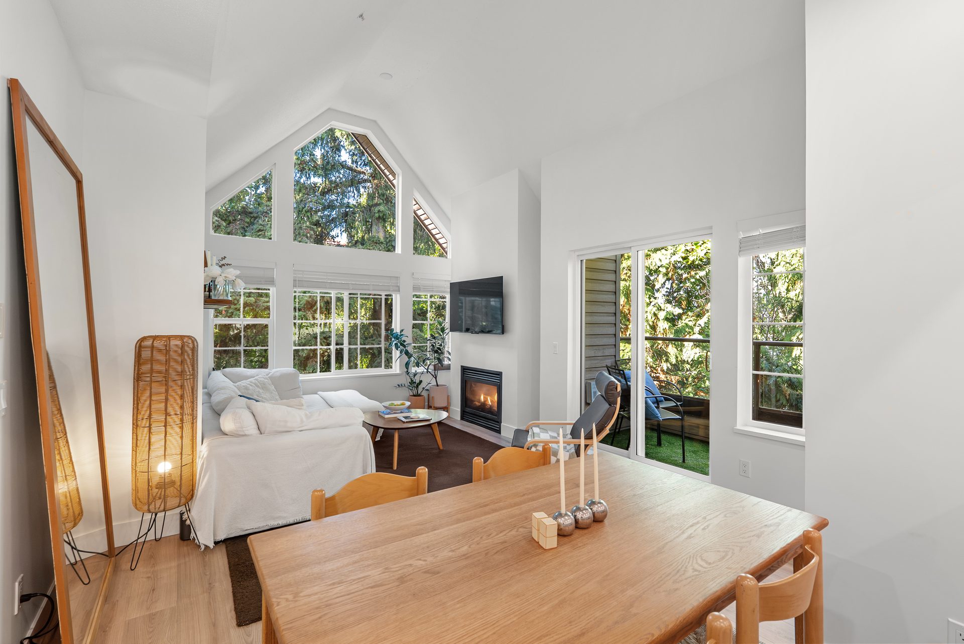 Living and dining area under the vaulted ceiling